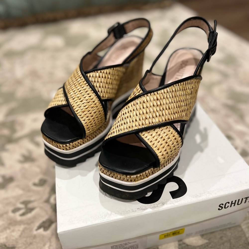 Schutz platform sling back. Rafia and black leather trim. Size 6.5